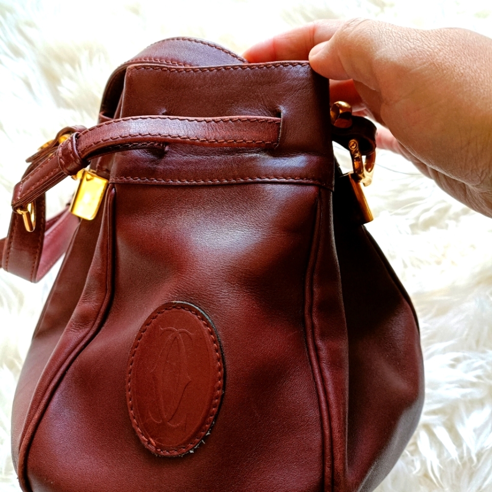 Must be Cartier Bordeaux leather bucket bag